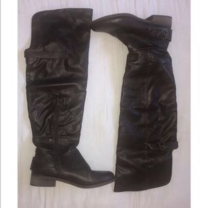 Over the knee, brown boots.